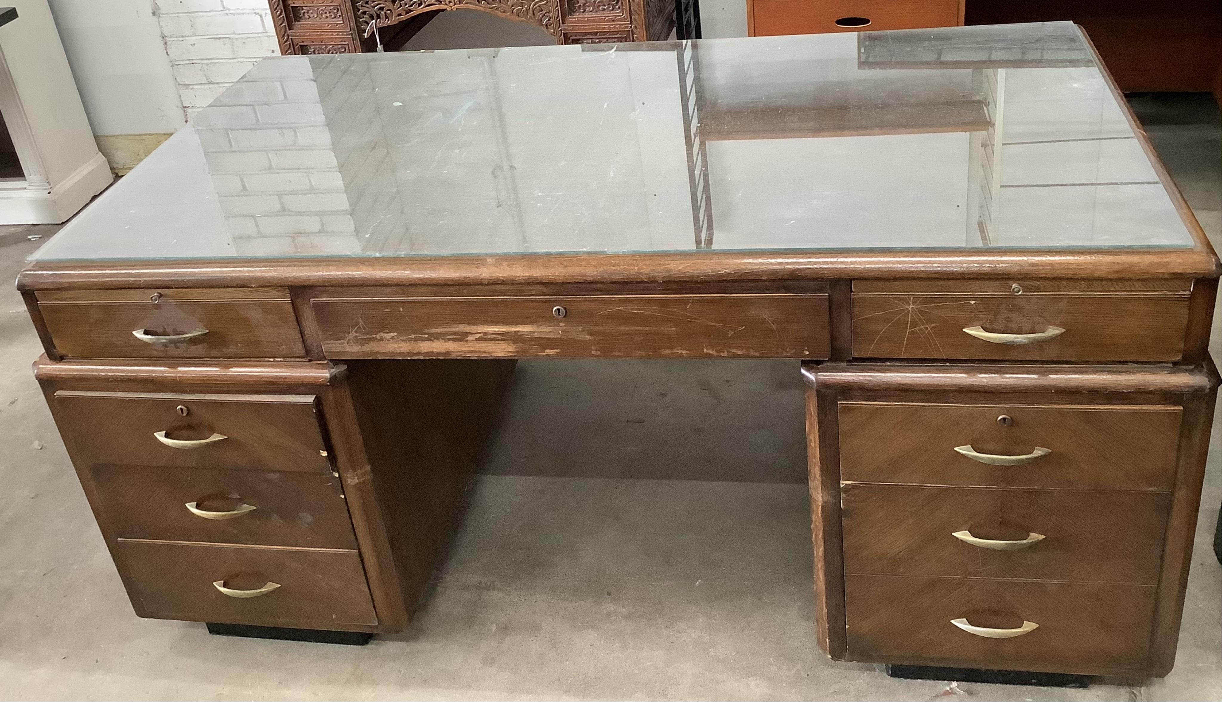 An early 20th century Continental oak pedestal desk, width 165cm, depth 94cm, height 78cm